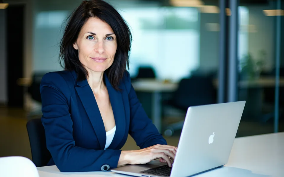 Greenopsiq founder in a professional workspace reviewing sustainability compliance data